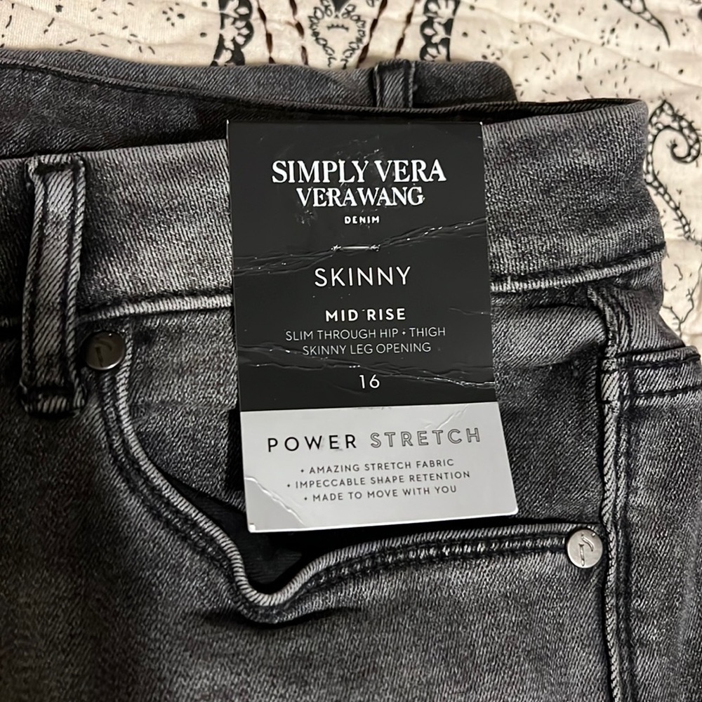 Women’s black/gray jeans size 16. Mid rise skinny. Brand new with tags.